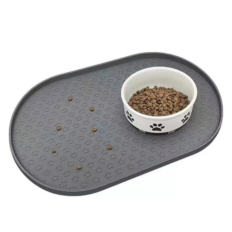 Grey silicone pet feeding mat with raised edge and pet bowl